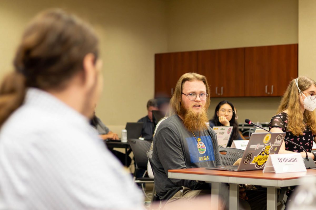 Sen. Kian Williams speaks in favor of a piece of legislation they wrote at the Sept. 11 SGA meeting. Williams wrote a resolution denouncing antisemitism after an incident on campus the previous semester. 