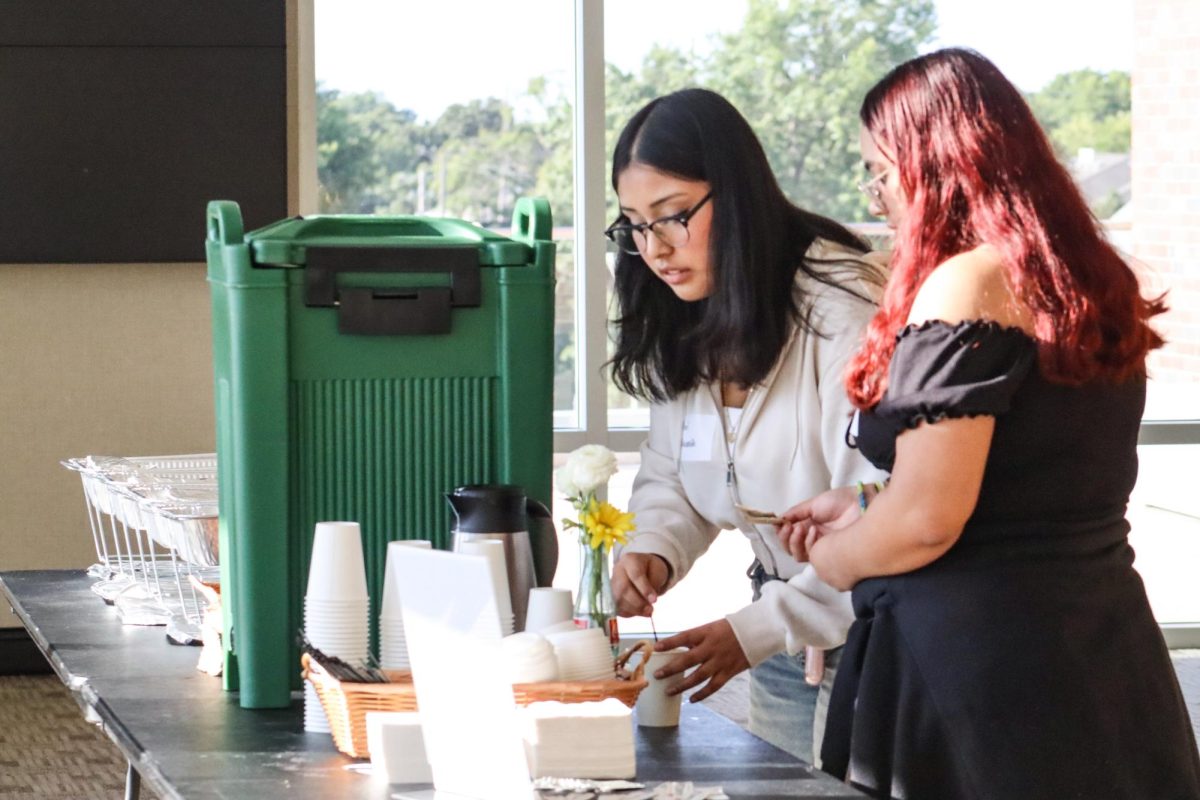 High school students Abril Navarrete and Betsey Ramirez enjoyed refreshments at the HALO conference. The event welcomed students from across Kansas, offering insights on how to grow their high school clubs.