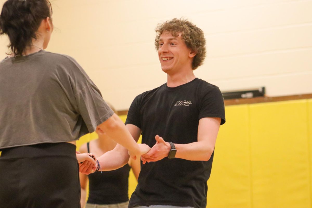 Senior Logan Oesterreich learns a new dance step at the Westie Swing Club. The club teaches the West Coast style of swing dancing every Monday at the Heskett Center.