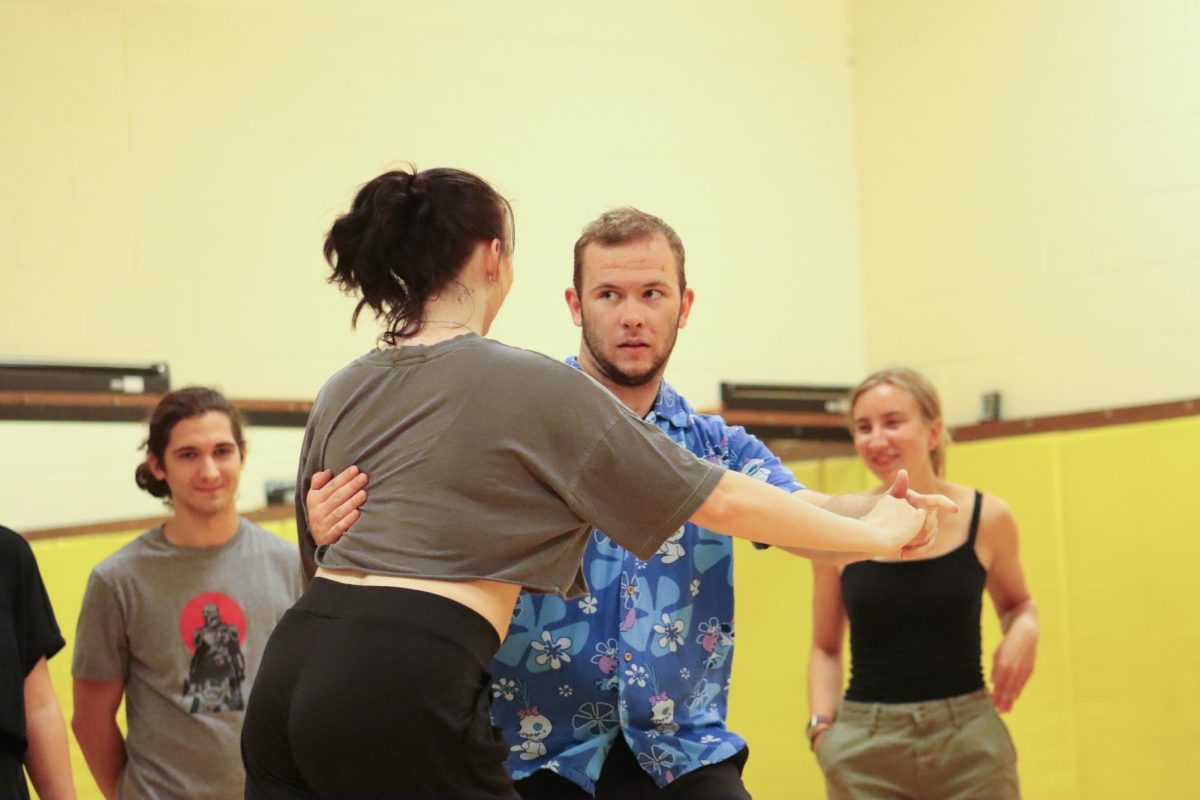 Wichita State juniors Jordan Manning and Trinity Madden dance together at a club meeting. The Westie Swing Club is accessible to all students who seek to learn West Coast Swing dances.