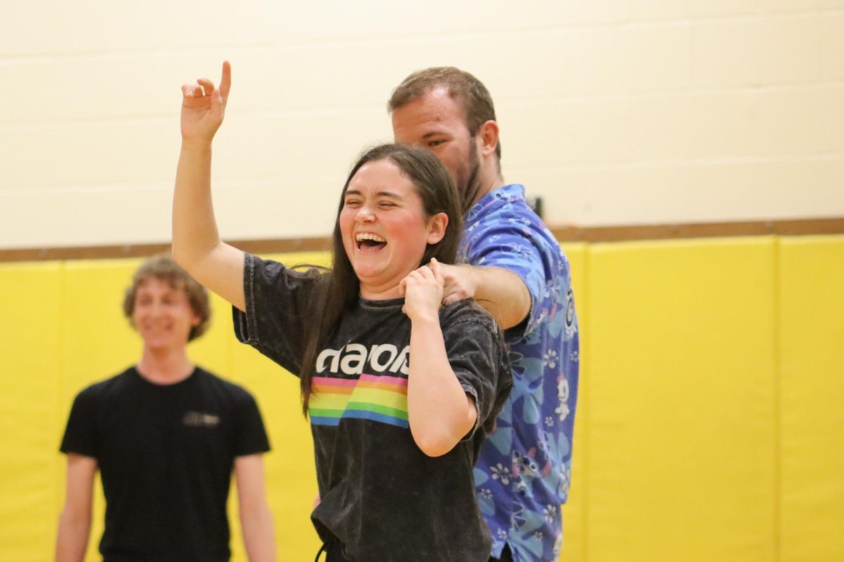 Senior Megan Castillo laughs while dancing with partner during a club meeting at the Heskett Center. The Westie Swing Club provided an opportunity to learn the West Coast Swing partner dance.