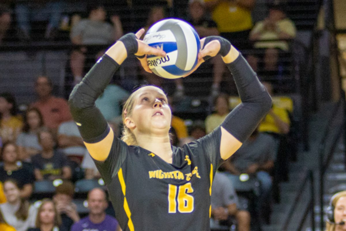 Fifth-year Wichita State setter Izzi Strand sets up a teammate during the game against Kansas State on Aug. 24. Strand was fifth in the NCAA in assists last season.