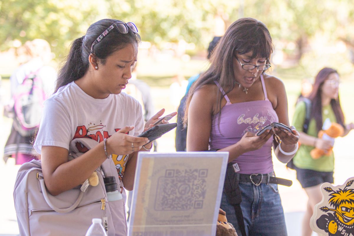 Hailey Garcia and Sonnia Evbota-Momodu register to vote at the National Voter Registration Day fair, hosted by Shockers Vote! Coalition. Gracia is a transfer student at Wichita State, majoring in social work, and Evbota-Momodu is majoring in psychology and marketing.