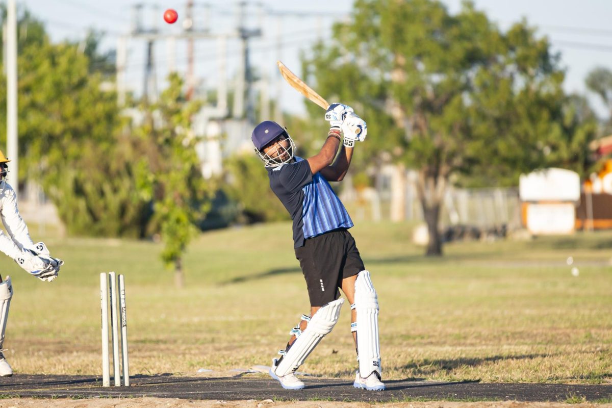 Sai Charan Reddy watches as the ball flies through the air. He is a member of WSU's Cricket Club team, which has operated in some form for more than 30 years.