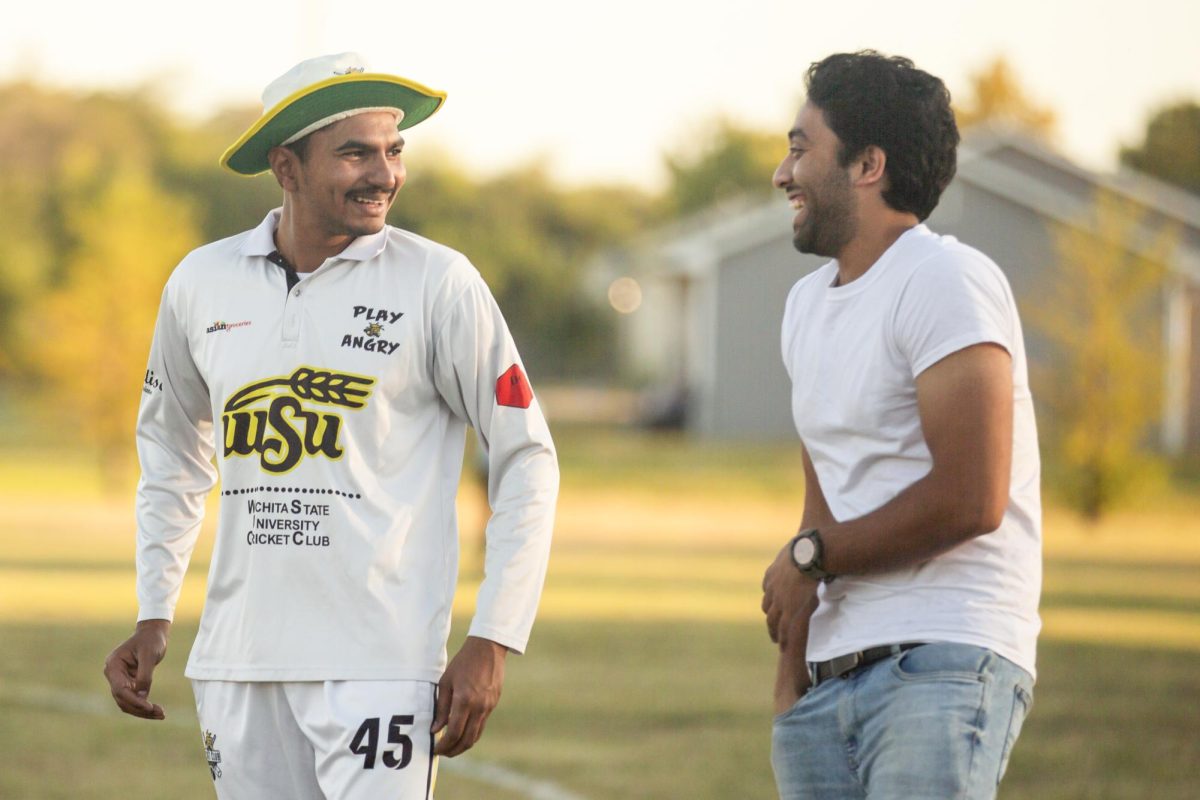 Phani Teja Palakodety and Rohan Varma Dantuluri joke together during Cricket Club practice. The two are part of a more than 100-person league.