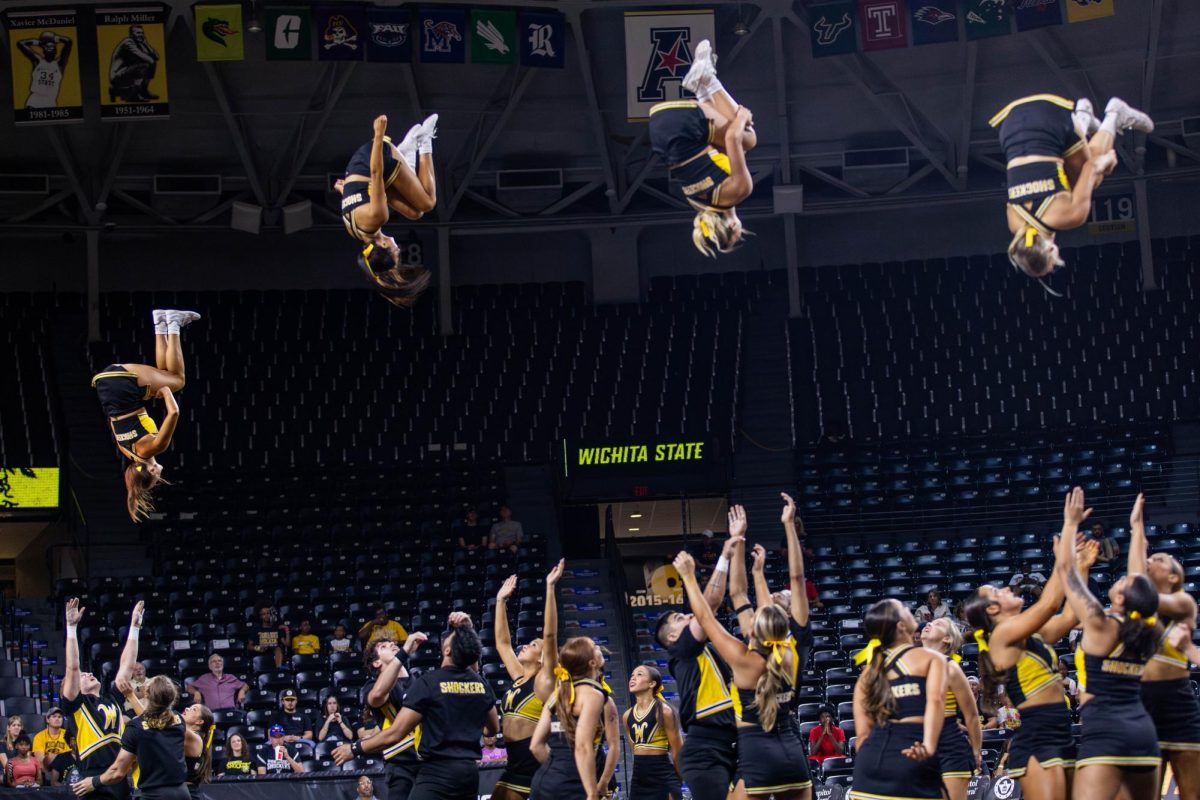 The Wichita State cheer team performs a group routine on Oct. 5. The cheer team also won the Shocktober Fest spirit award at Shocker Madness.