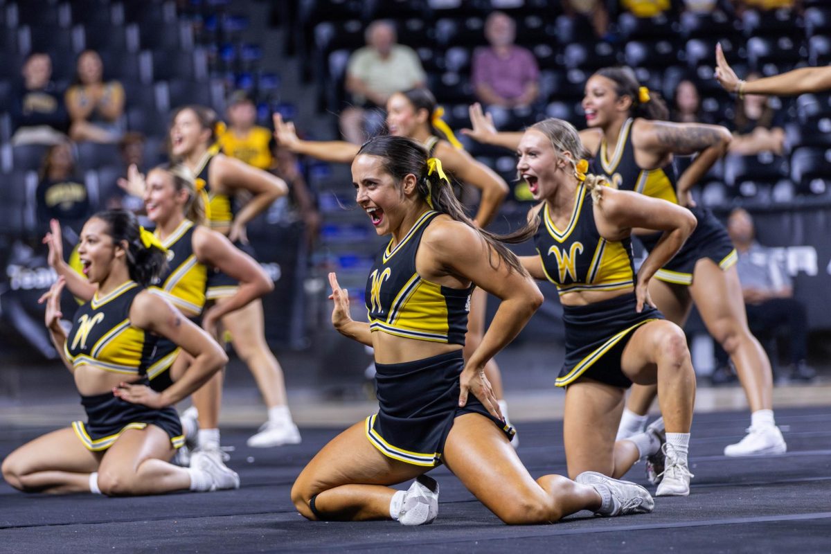 The Wichita State cheer team performs a group routine on Oct. 5. The cheer team also won the Shocktober Fest spirit award at Shocker Madness.