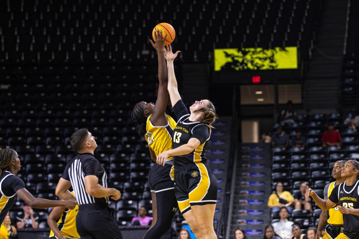 Aicha Ndour and Ella Anciaux jump for possession of the ball during the Oct. 5 scrimmage. Wichita State has their exhibition game against Northeastern State on Oct. 30.