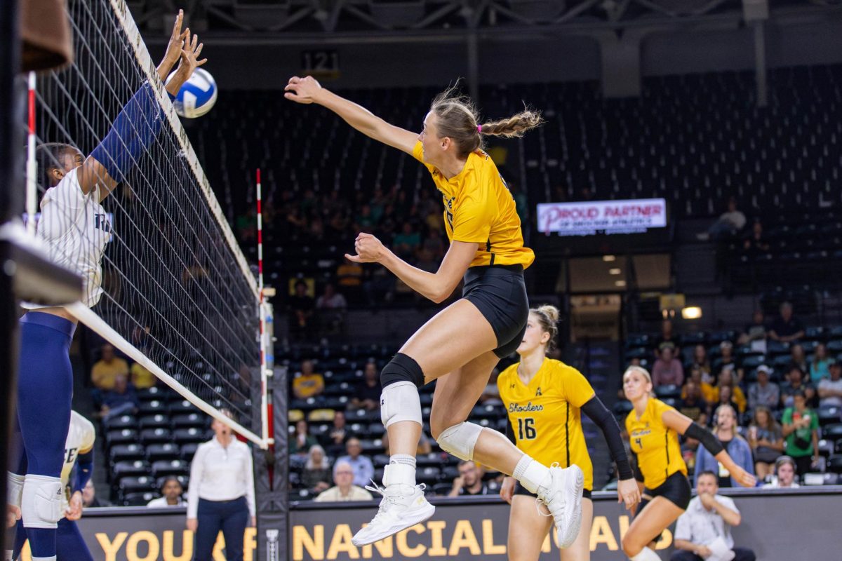 Morgan Stout attempts a kill in the first set against Rice on Oct. 6. Stout, a redshirt senior, made 13 kills throughout the game.