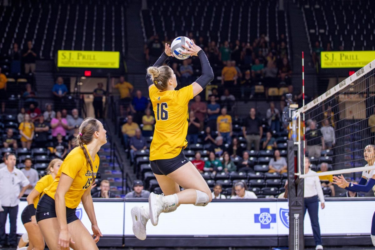 Izzi Strand sets the ball to a teammate during the second set against Rice. Strand made 44 assists during the game.