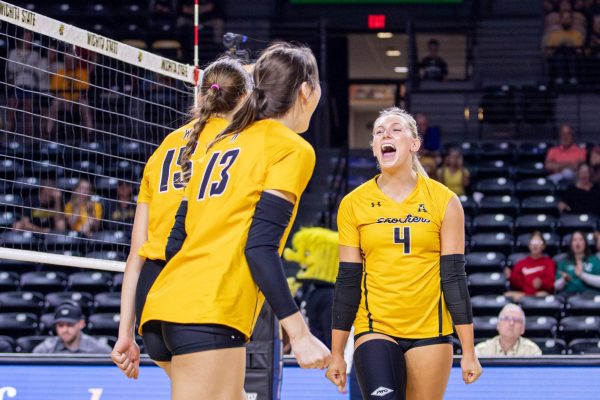 Brooklyn Leggett and her teammates celebrate after scoring a point in the third set on Oct. 6. Wichita State took the third set against Rice 25-22.