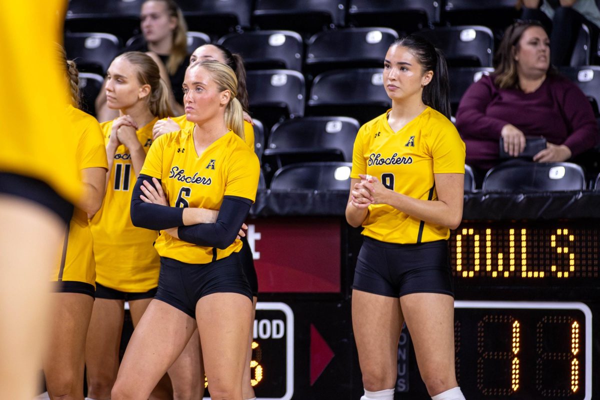 Wichita State players stand on the sidelines in the fifth set against Rice. The Shockers fell to the Owls 3-2 on Oct. 6.