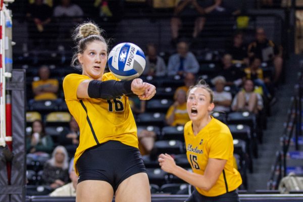 Setter Izzi Strand passes the ball to a teammate during the first set on Oct. 6. Wichita State lost against Rice, 3-2.