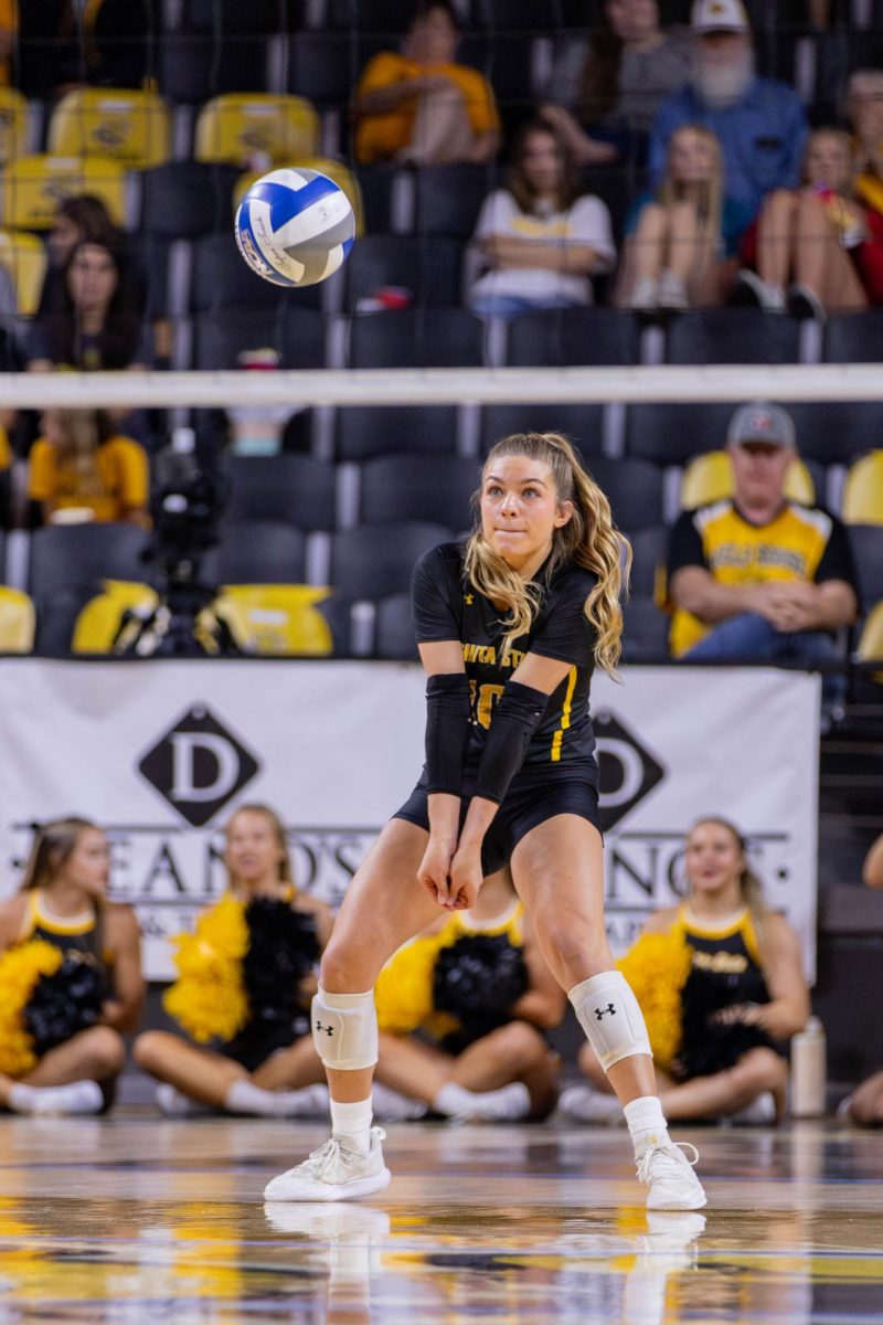 Annalie Heliste digs the ball in the first set. Heliste, a senior, made 11 digs during the Oct. 6 game.