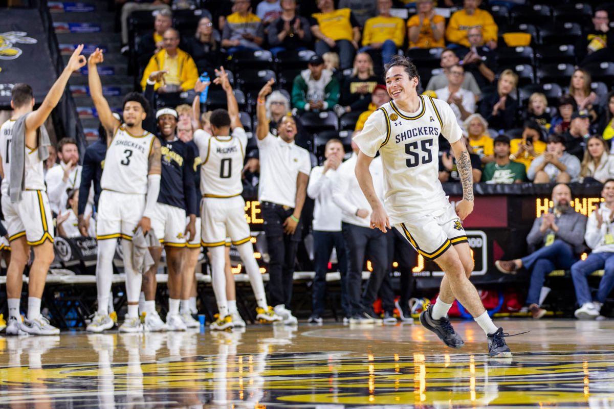 Bijan Cortes celebrates a Wichita State 3-pointer in the first half. Cortes made both of his attempted 3-pointers on Oct. 27.