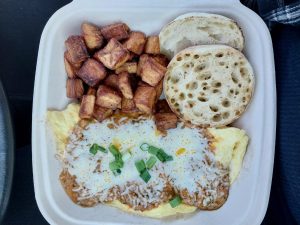 Another Broken Egg's Bacquezo omelette, topped with sautéed chorizo cheddar jack cheese and green onions. It comes with an English muffin and country potatoes. 