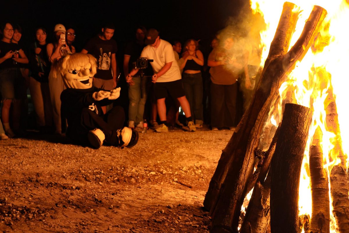 WSU mascot WuShock warms up by the Shocktoberfest bonfire. Since 1991, Wichita State’s annual fall tradition, Shocktoberfest, has celebrated school pride.