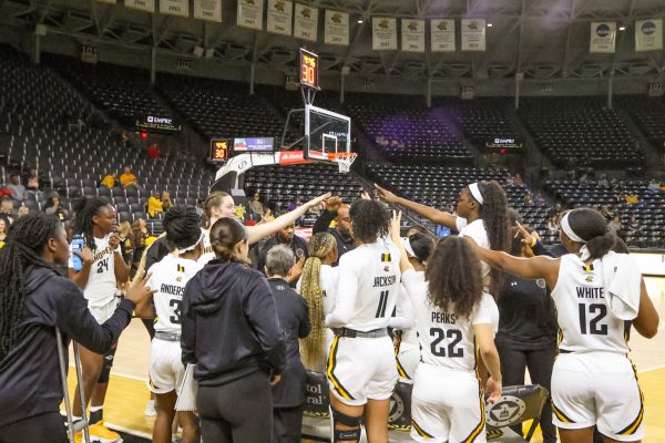 Wichita State women’s basketball finishes a team huddle during a timeout. The final score of the exhibition game against Northeastern State was 81-46 Wichita State.