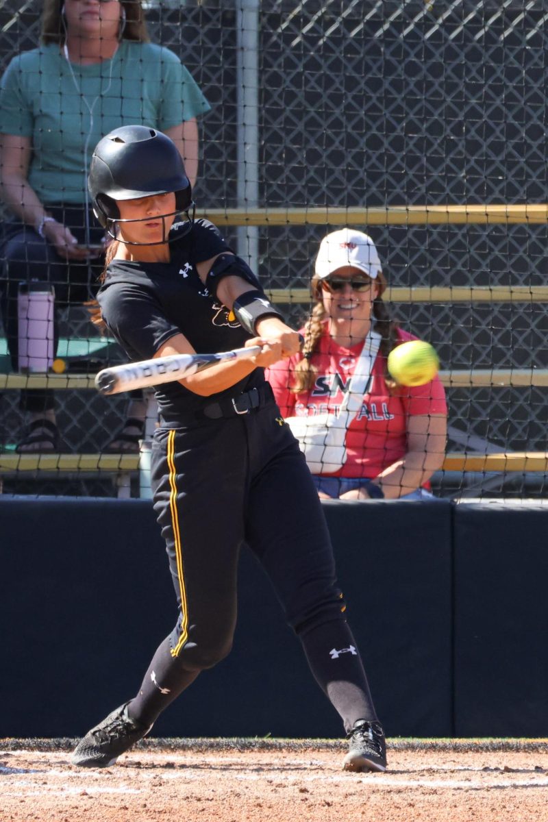 Junior Jodie Epperson attempts to hit a pitch during the game on Oct. 5. This is Epperson’s first year playing for the Shockers after transferring from the University of North Texas.