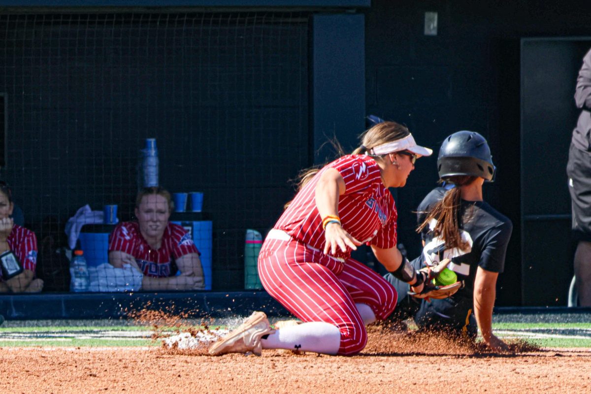 Junior Jodie Epperson slides into third base, just barely making it before being tagged. Wichita State’s softball team faced off against Southern Nazarene in its final fall game.