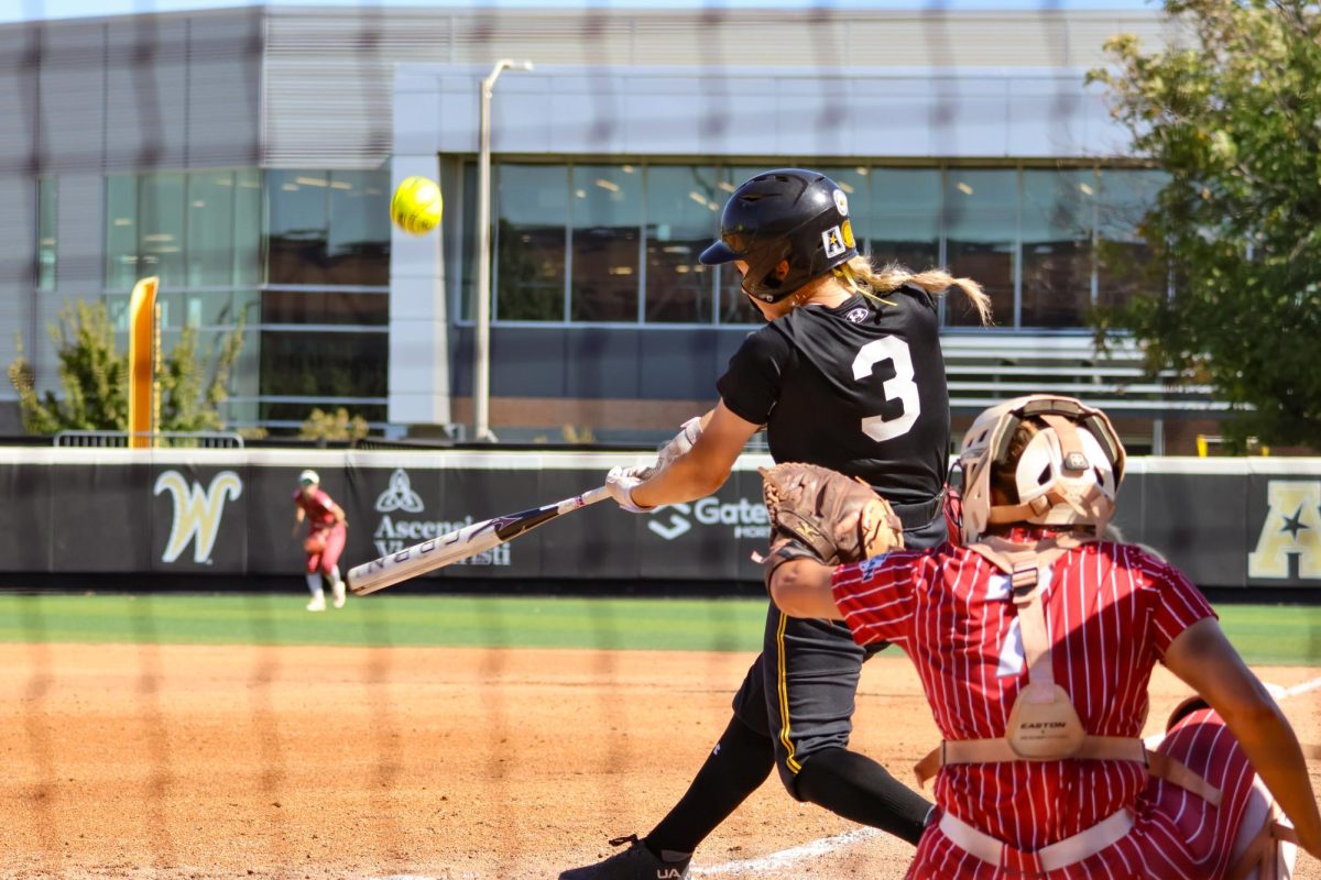 Freshman Morgan Lloyd hits ball into play during the game on Oct. 5. Lloyd, had a batting average of .438 as a junior in high school.