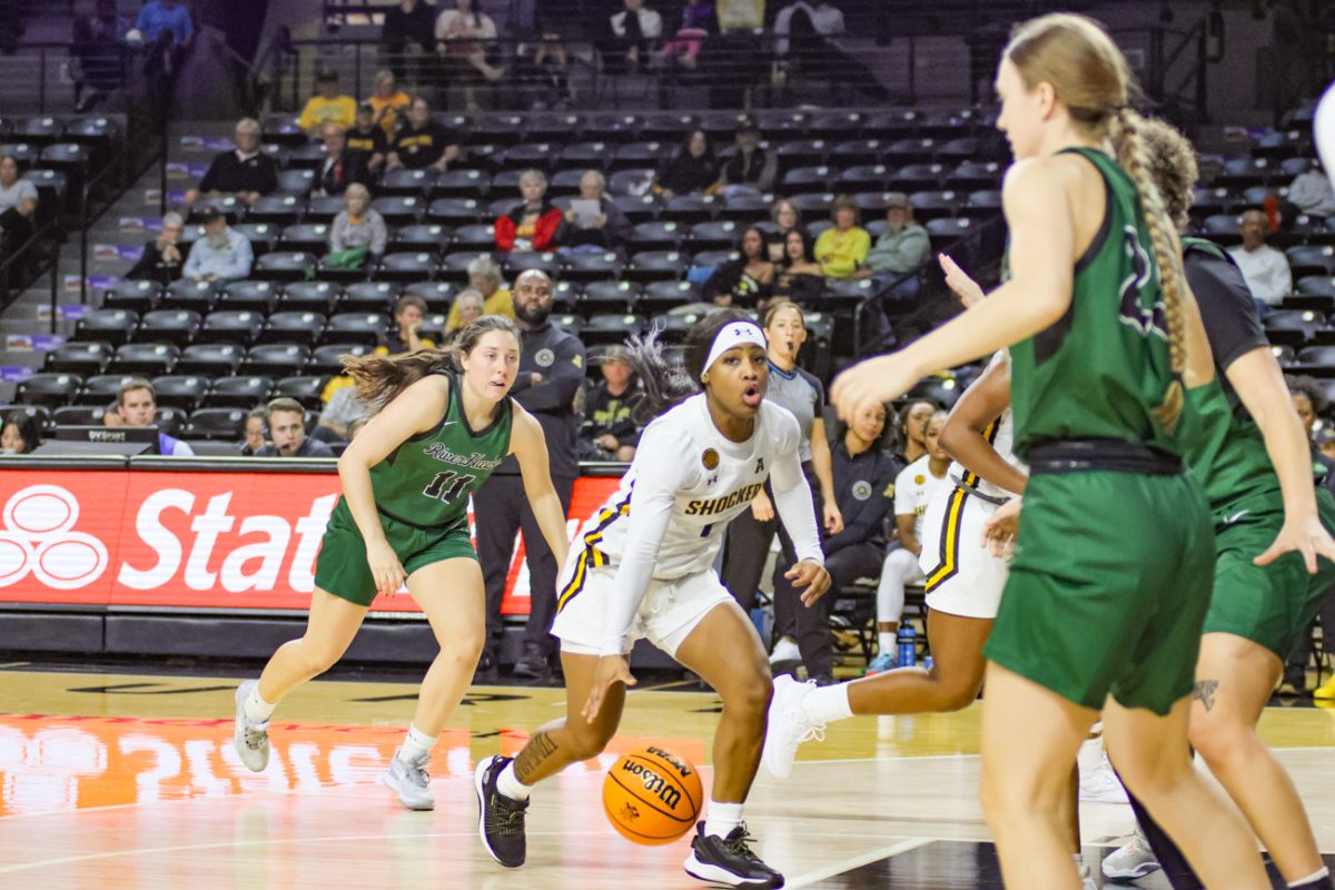 Freshman KP Parr dribbles the ball down the court against Northeastern State. Parr won back-to-back 4A Texas State Championships in high school and is one of two true freshmen on the team.