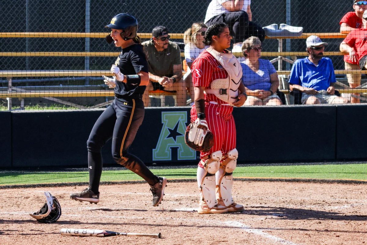 Graduate student Lauren Lucas smiles as she runs through home plate, scoring a run. In the 2023 season, she had an batting average of .384, recording 68 hits over 55 games.