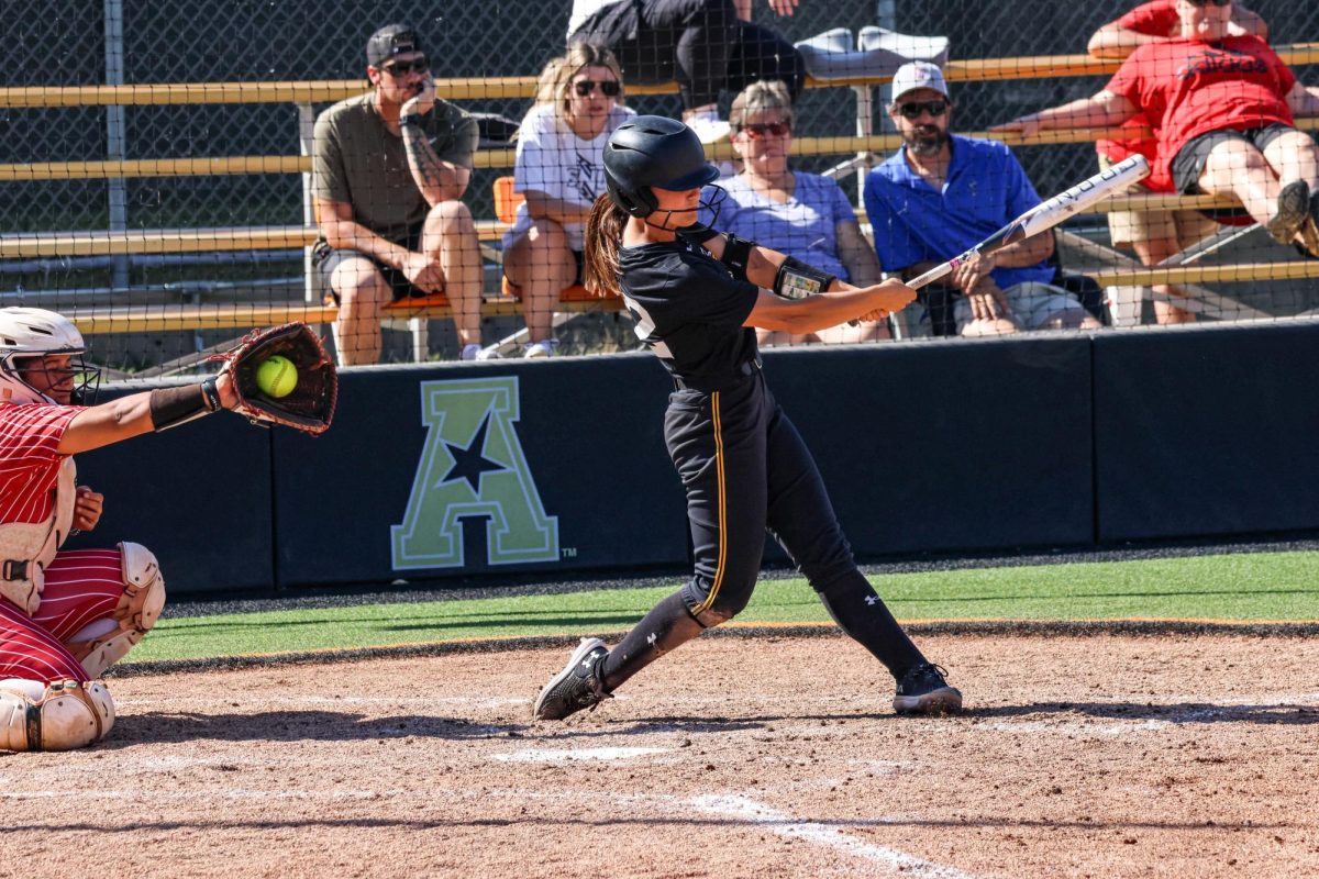 Junior Jodie Epperson swings and misses at a pitch against Southern Nazarene University on Oct. 5. WSU softball played their last fall game against the Thunder Cats at 1 p.m. at Wilkins Stadium.