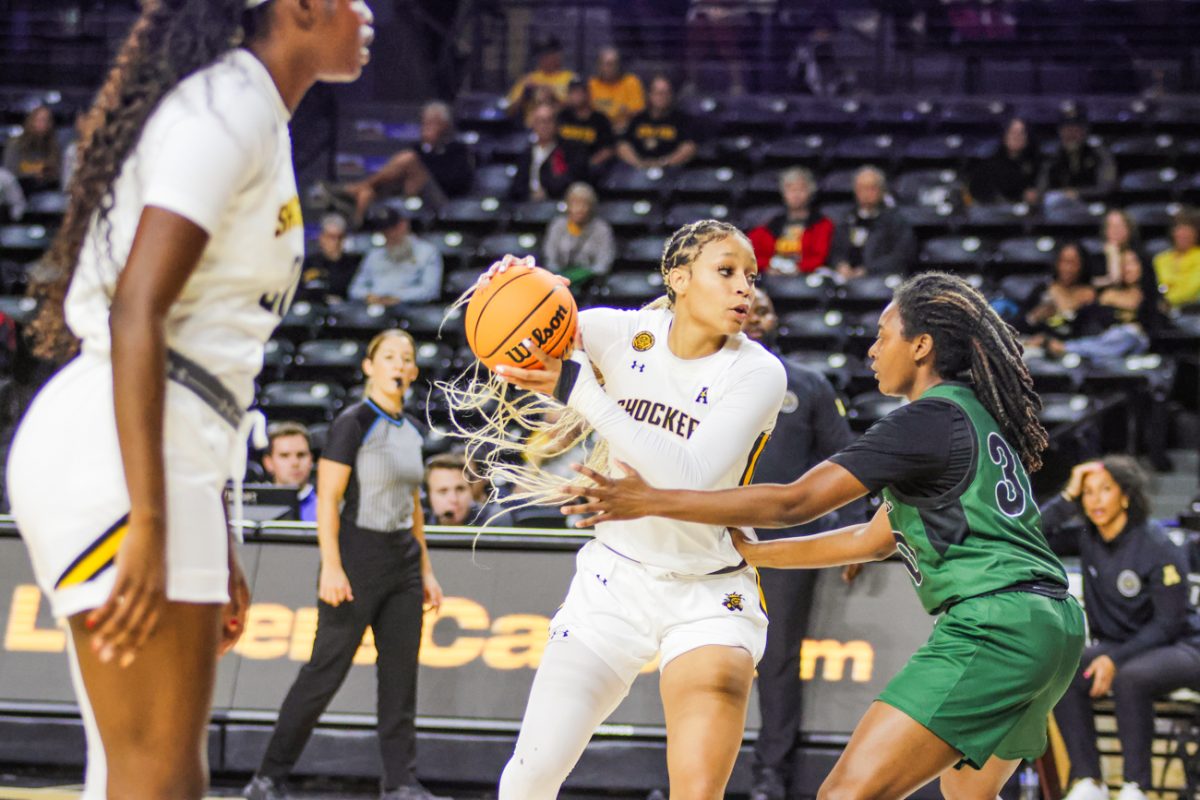 Junior Jayla Murray plays offense against Northeastern State on Oct. 30. Murray scored 10 points as Wichita State won, 81-46.