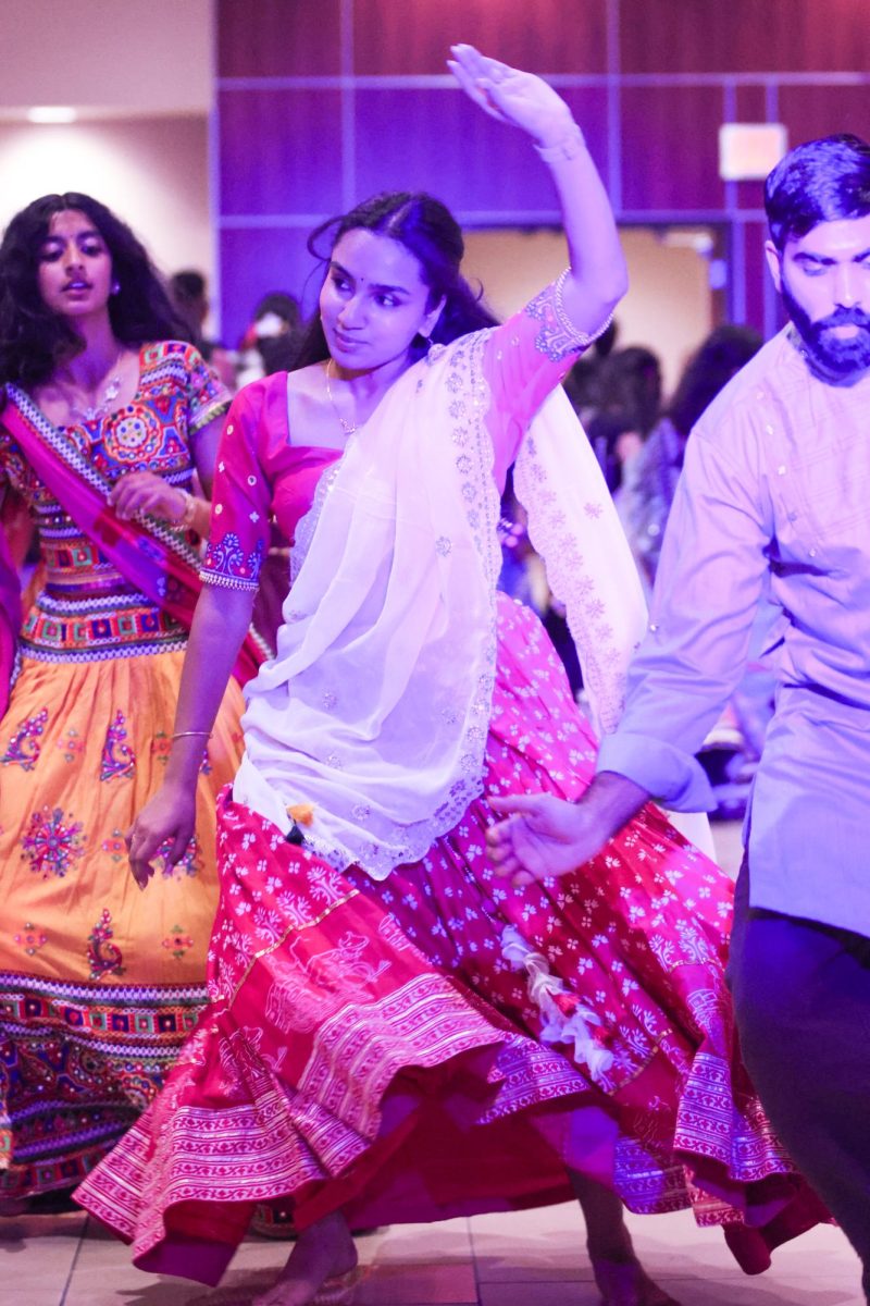 Lakshmishree Sivakumar twirls in a Garba line at the Garba Night. The dance involves a series of synchronized steps performed by the entire group.