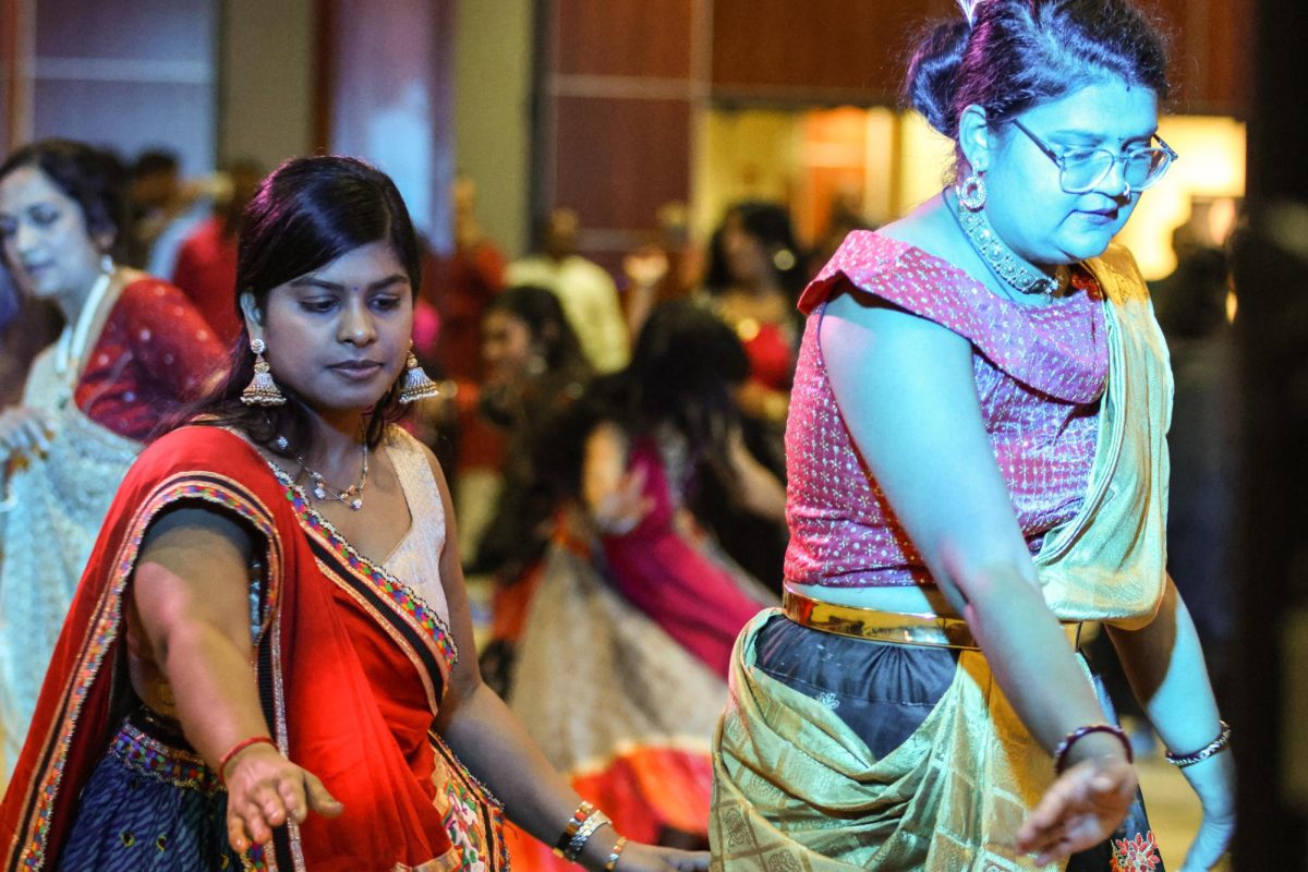 Praiyanka Katthi and Jyoti Ahir move with the flow of the Garba dance, maintaining the energy with the dancers and ensuring the entire group moves in harmony.