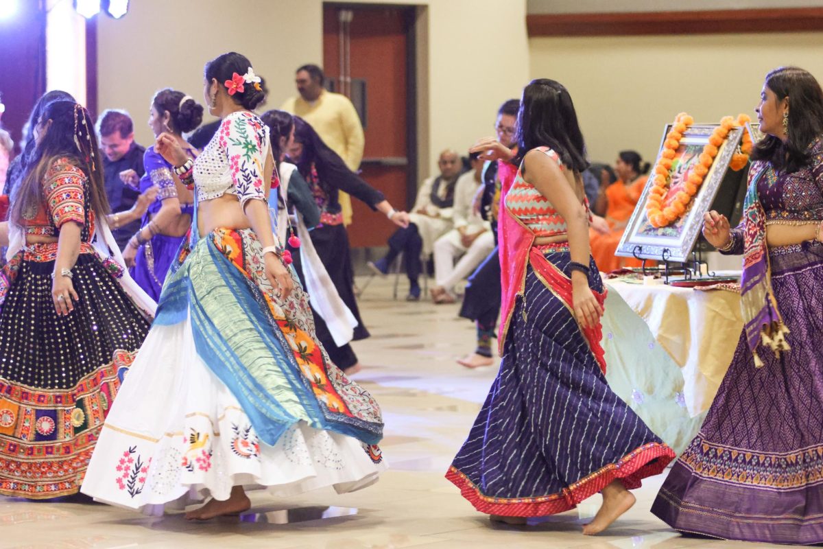 Dancers form a circle around the Hindu goddess Durga. The circular movements are meant to reflect the natural cycles of life, such as birth and rebirth.