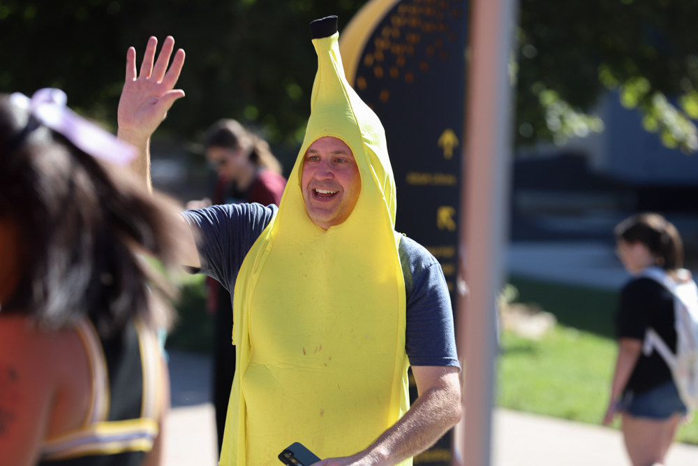 Chris Lathem partakes in helping his son's fraternity run a Smoothie King booth while dressed as a banana. As a part of the "Shocktoberfest Kickoff" on Sept. 30, the booth primarily passed out drinks and towels. 