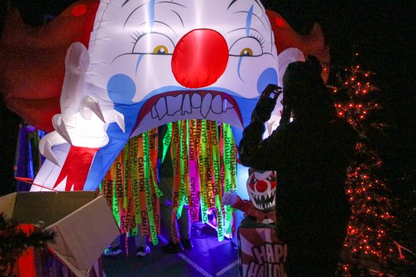 A visitor at the Heskett Center's "Fright Night" cautiously walks into the final section of the attraction on Oct. 25. Heskett workers -- many being WSU students -- played roles of scaring attendees inside the Haunted House.