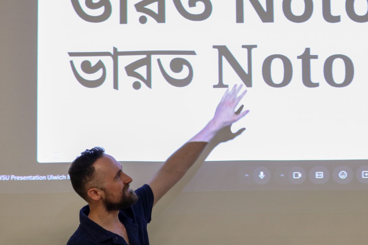 Guest speaker Dave Crossland points at an different fonts during his lecture. Crossland discussed the global importance of typography on day two of WSU's "MIDPOINT" event.