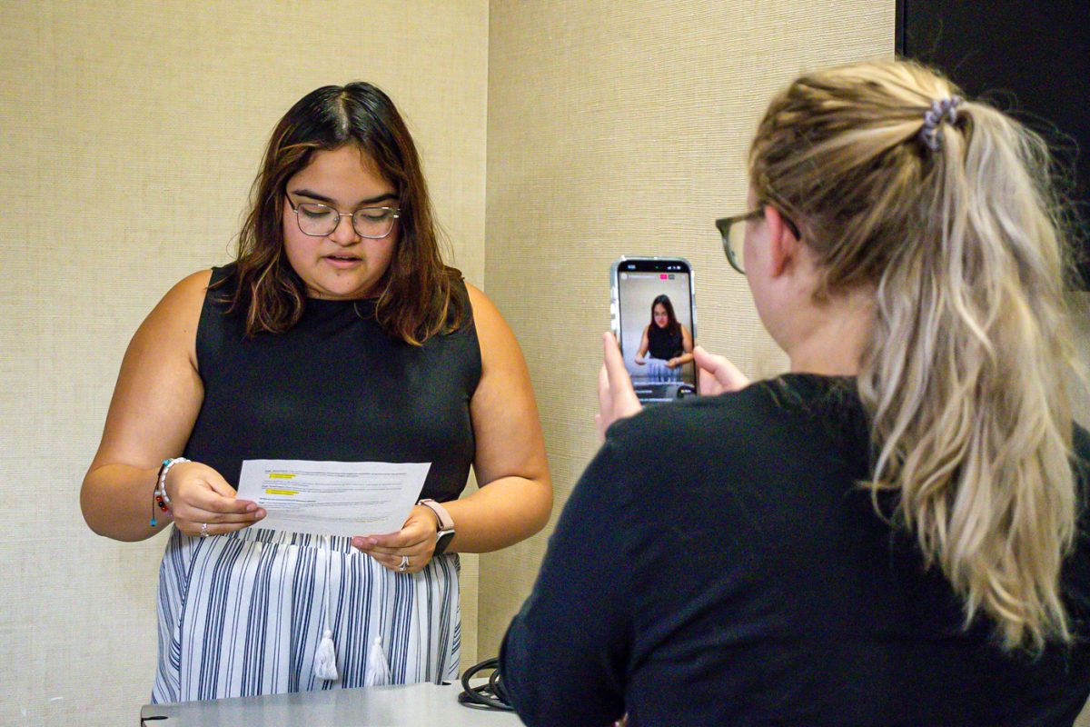 Gigi Dominquez reads the uncertified election results on Wednesday, Oct. 2. Abby Whisler livestreamed the annoucement on the Student Government Association's Instagram.