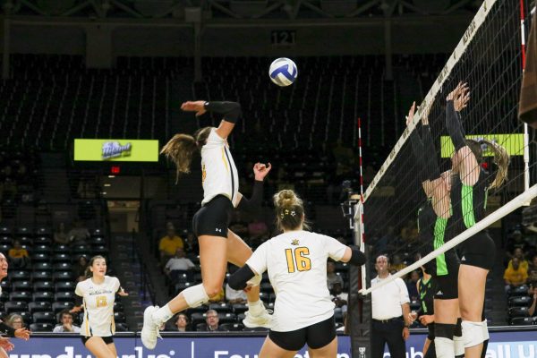 Senior Morgan Stout attempts a kill against South Florida. Stout finished the match with 7 kills. Wichita State fell to South Florida with a final score of 3-1.