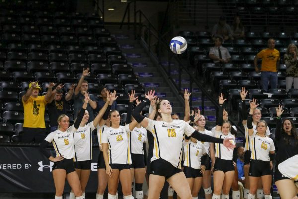 Fifth-year setter Izzi Strand serves during Wichita State’s game against South Florida on Oct. 11. South Florida's strong performance led the Bulls to a 3-1 victory.