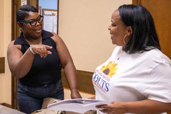 Keisha McClish Couts, running for district 91 and volunteer Sadie Tolbert talk during a volunteer meeting on Sep. 27.