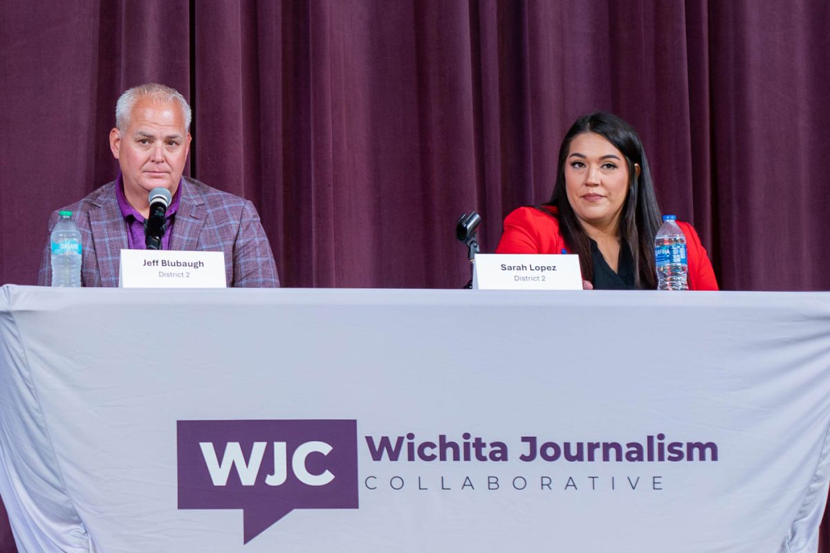 Jeff Blubaugh and Sarah Lopez prepare for a forum at on housing at Friend's University. The candidates discussed subjects such as new home ownership, zoning, taxes, and more.