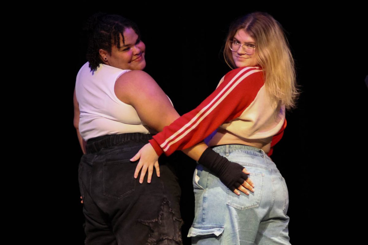 Brooklynn Robinson and Sarah Nuse, members of the "Dream Team" dance group, pose at the end of their performance.