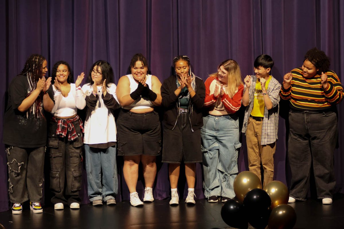 Members of the "Dream Team" dance group celebrate after winning 2nd place during the annual BSU Talent Show. The team finished with a score of 26 out of 30.