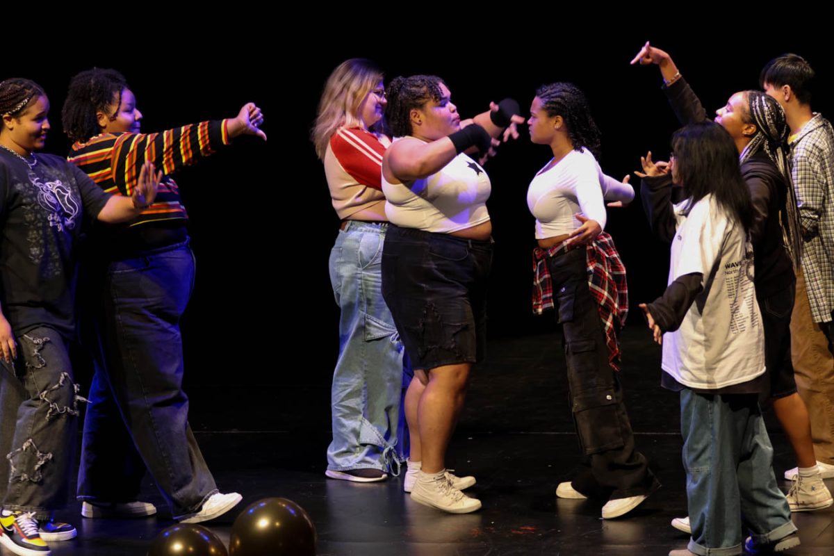 Members of the "Dream Team" dance group "face off" against each other as part of their "Bring It On" inspired routine for the BSU Talent Show.