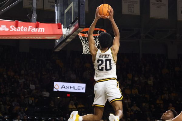 Redshirt senior Harlond Beverly throws down  a alley-oop at the end of the first half. The Shockers were up 46-31 at the half.