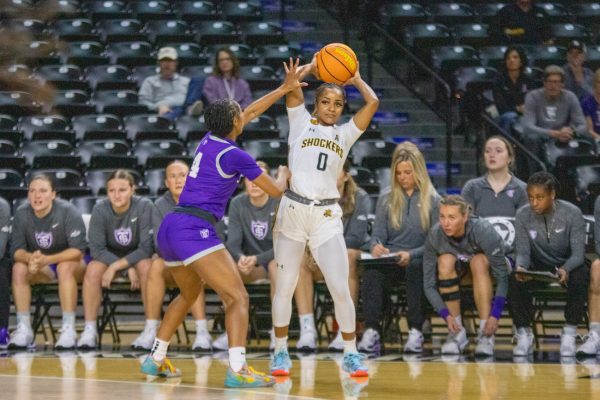 Graduate student guard Taylor Jameson inbounds the ball against the University of St. Thomas – Minnesota on Nov. 16. WSU won against St. Thomas, 69-64.