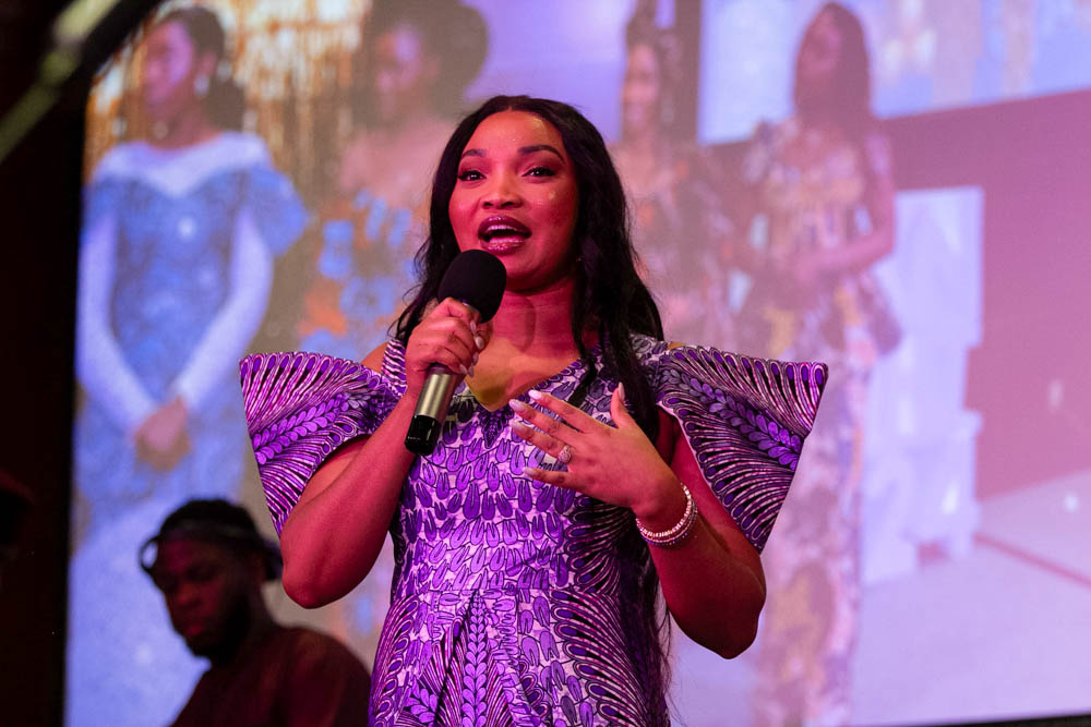 Kapinga Victoria Tshianyi, the owner of LadyKay Boutique, speaks to Afro Karibbean Night attendees after the event's fashion show. Tshianyi dressed several of the students-turned-models in her own African-inspired gowns and patterns.