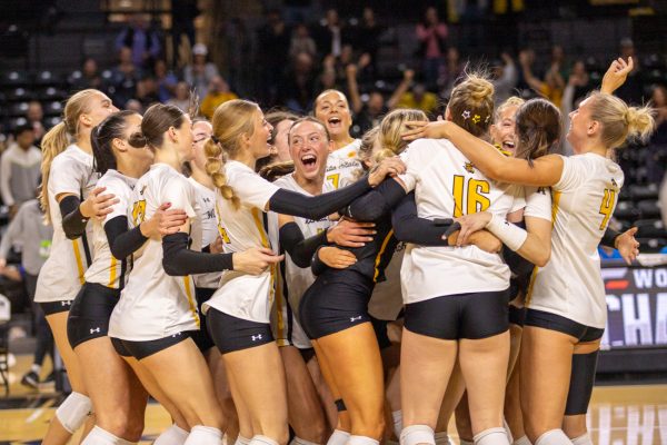 Wichita State's volleyball team cheers after winning the AAC Tournament semifinal game against South Florida on Nov. 23. The win took Wichita State to play in the finals against Florida Atlantic on Nov. 24.