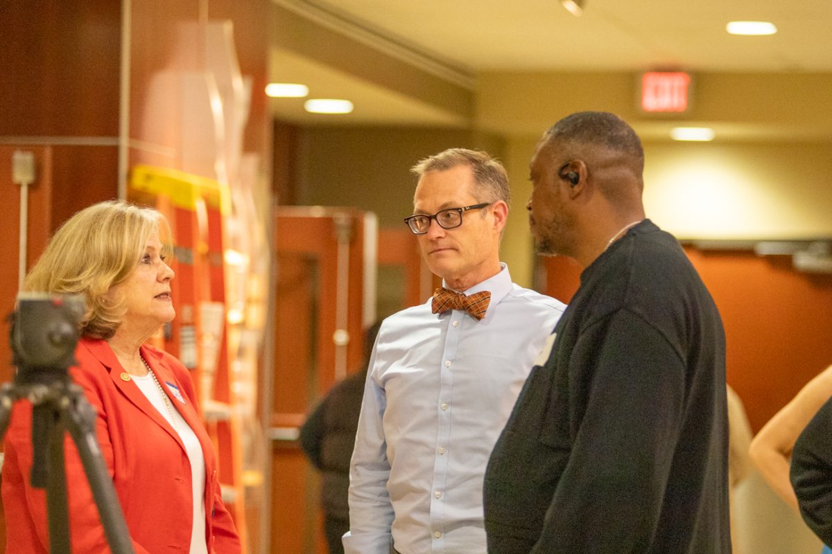 Celeste Racette, a candidate for Sedgwick County Commission speaks with Jeffery Jarman, a candidate for Kansas Board of Education. Both lost their races, according to unofficial election night results.