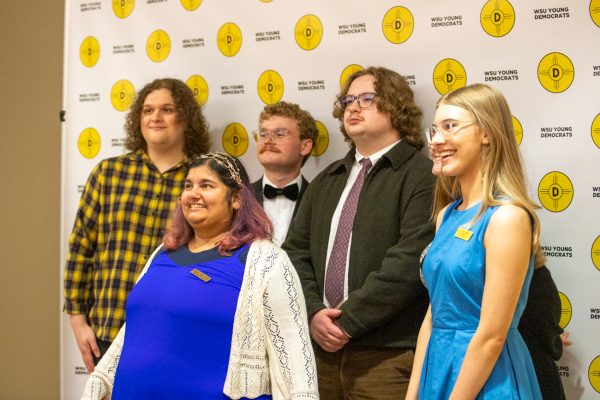 Members of the Wichita State Young Democrats pose for a photo outside of the election watch party hosted by the organization. WSU Young Democrats were one of three student groups to hold election night events in the Rhatigan Student Center on Nov. 5.