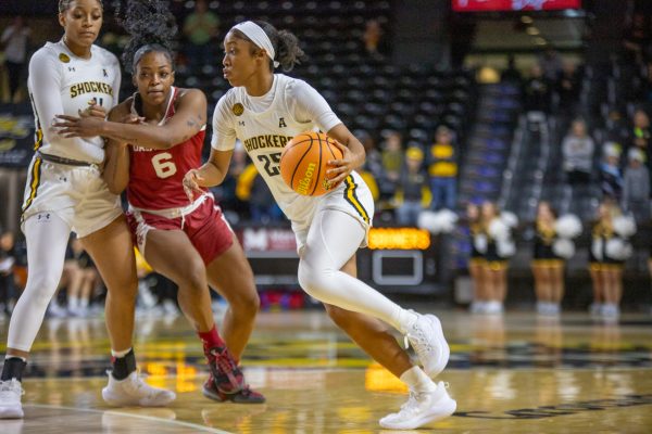 Sophomore guard Salese Blow dribbles the ball on offense against Oklahoma on Nov. 19. Wichita State lost the game against the ranked opponent, 79-49.